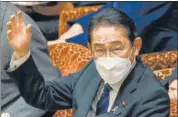  ?? AFP ?? PM Fumio Kishida raises a hand to answer questions during the budget committee session at the parliament in Tokyo.