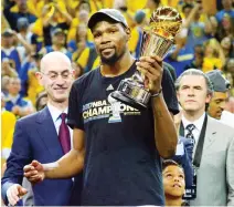  ??  ?? Golden State Warriors forward Kevin Durant celebrates after winning the NBA Finals MVP in game 5 at the Oracle Arena. (USA TODAY Sports)