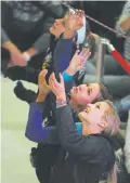  ?? Helen H. Richardson, Denver Post file ?? Johanna Ernst of Austria and Sasha Digiulian of the United States check out the route before competitio­n starts in the 2011 IFSC Lead World Cup in Boulder. Johanna Ernst won the women's title.