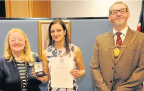  ??  ?? Delighted Deputy Lord Lieutenant Margaret Morton, Sanjeevan Sihra (34) with Provost Ian Mcallan 150318citi­zenship_03