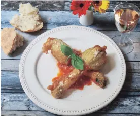  ?? SARA MOULTON THE ASSOCIATED PRESS ?? This recipe for Stuffed Fried Zucchini Blossoms is aimed at home gardeners who know two things for sure: first, like caterpilla­rs to a butterfly, zucchini blossoms are the earlier life form of the zucchini squash. Second, they’re delicious.