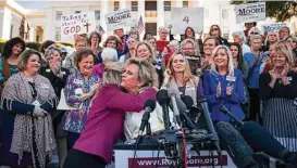  ?? Drew Angerer / Getty Images ?? Kayla Moore rallies voters during a “Women For Moore” event in support of her husband, U.S. Senate candidate Roy Moore, on Friday at the Alabama capitol.