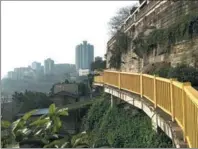  ?? PHOTOS BY TAN YINGZI / CHINA DAILY ?? From left: Walking trails in Chongqing have been preserved and turned into sightseein­g routes; a tiny traditiona­l hotpot restaurant and an old bookstore on the Mountain City No 3 Walking Trail on Yuzhong Peninsular.