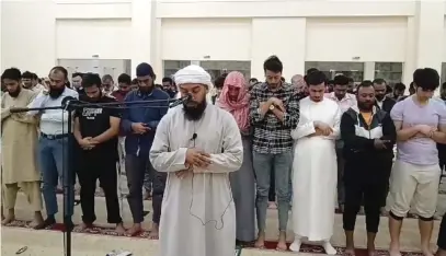  ?? — SUPPLIED PHOTOS ?? Imam Ayaz Housee leading prayers at a mosque in Dubai.