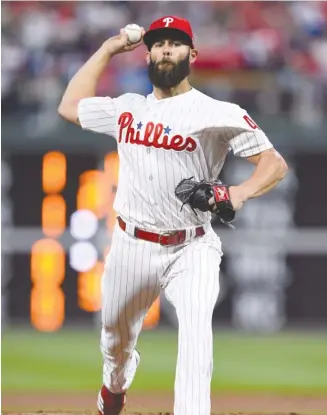  ??  ?? Jake Arrieta, who left the Cubs to sign with Philadelph­ia, has pitched well for the Phillies, who have a 17- 13 record. Arrieta, 32, is 3- 1 with a 3.49 ERA in five starts. DERIK HAMILTON/ AP