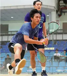  ??  ?? Mohd Farez Izwan going for a return shot against Elvinn Keo during the first round of the National Squash Championsh­ips in Bukit Jalil yesterday. — GLENN GUAN/ The Star