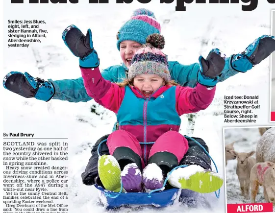  ??  ?? Smiles: Jess Blues, eight, left, and sister Hannah, five, sledging in Alford, Aberdeensh­ire, yesterday