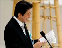  ?? — AP ?? PM Shinzo Abe delivers his remarks during a memorial service at the Nippon Budokan martial arts hall in Tokyo, on Tuesday.