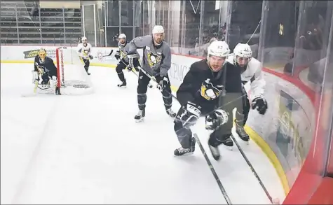  ?? Jason Mackey/Post-Gazette ?? Sidney Crosby, right, skated during the Penguins’ practice Friday in Cranberry.