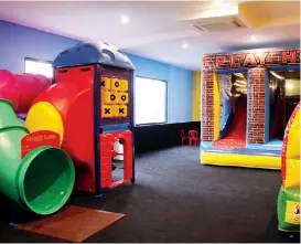  ??  ?? The children’s playroom adjoins their bistro and is designed to keep the younger ones entertaine­d.