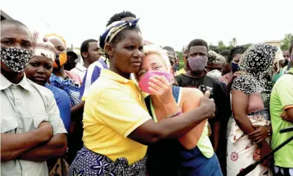  ?? Photograph: Reuters ?? Crowds gathered at Pemba port to welcome their relatives.