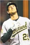  ?? Adam Glanzman / Getty Images ?? Stephen Piscotty taps his chest as he crosses the plate following his home run.