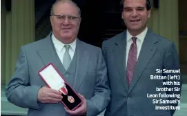  ?? PHOTO: ALAMY ?? Sir Samuel Brittan (left) with his brother Sir Leon following Sir Samuel’s investitur­e