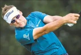  ?? Stephen B. Morton / Associated Press ?? Ian Poulter drives his ball off the 17th tee during the third round of the RBC Heritage golf tournament in Hilton Head Island, S.C., on Saturday.