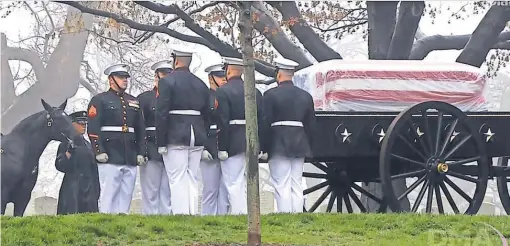  ?? AFP/ GETTY IMAGES ?? Former NASA astronaut and U. S. Sen. John Glenn was laid to rest April 6 at Arlington National Cemetery in Virginia. The Air Force is investigat­ing allegation­s that an offer wasmade to show Glenn’s remains while his body was at Dover Air Force Base.