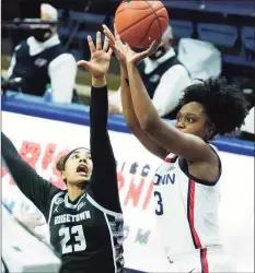  ?? David Butler II / Associated Press ?? UConn guard Christyn Williams ( 13) shoots against Georgetown guard Milan Bolden- Morris in the first half Saturday in Storrs.