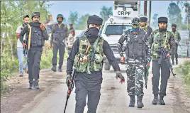  ??  ?? Security personnel during an encounter at Sopore in Baramulla district on Monday. Three militants, including top LeT militant Mudasir Pandit, were killed in the encounter.
