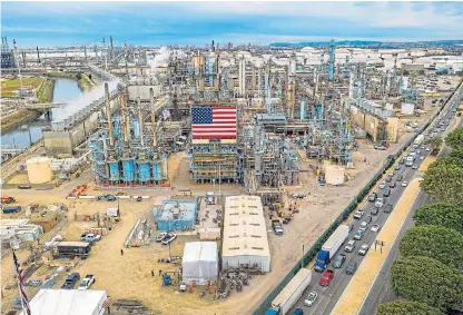  ?? /AFP ?? Keeping cars on the road: The Marathon petrol refinery in Carson, California. Global oil prices rebounded on March 10 on hopes of US economic stimulus efforts, one day after suffering their biggest losses in more than a decade.