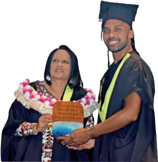  ?? Photo: Waisea Nasokia ?? Minister for Education, Heritage and Arts, Rosy Akbar hands over the valedictor­ian award to at the Inaugural Graduation Ceremony for the Conservato­rium of Dance at the Sofitel Fiji Resort on Denarau on November 13, 2020.