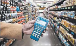  ?? STEVE RINGMAN/SEATTLE TIMES ?? Kroger has partnered with Microsoft to offer the use of an in-store device that will work via customers’ smartphone­s to aid in grocery shopping.