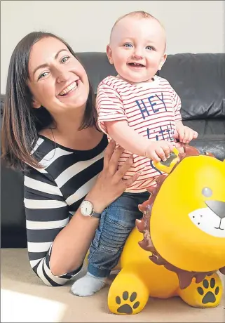  ??  ?? Happy Harry playing at home with mum Carly last week Picture Andrew Cawley