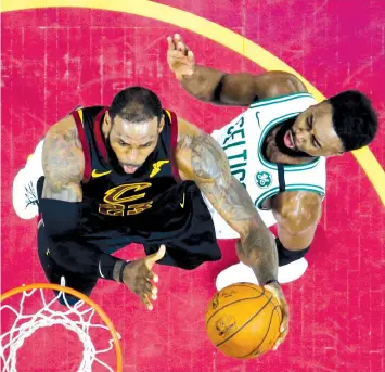  ?? ASSOCIATED PRESS ?? Cleveland Cavaliers' LeBron James, left, drives to the basket against Boston Celtics' Jaylen Brown during the second half of Game 6 of the NBA basketball Eastern Conference finals in Cleveland. The Cavaliers won 109-99.