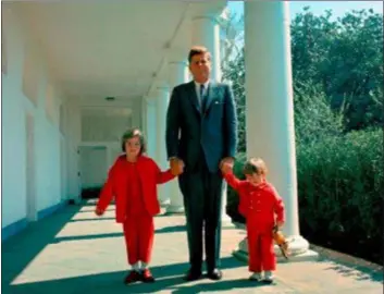  ?? SUBMITTED PHOTO ?? President John F. Kennedy walks with his children, Caroline and John Jr. on the walkway to the White House.