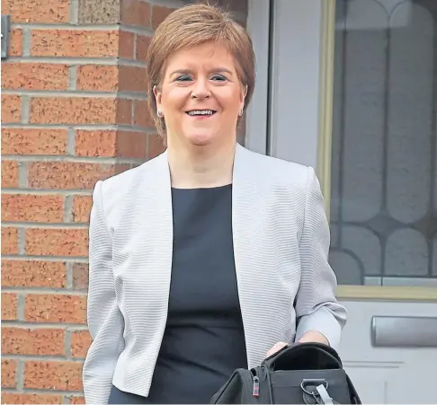  ??  ?? CLEARED: First Minister Nicola Sturgeon leaving her Glasgow home yesterday.