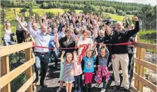  ??  ?? Active travel Villagers celebratin­g creation of new path at Dalrigh, Tyndrum, two years ago (picture by Ron Allner)