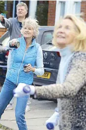  ?? REUTERS ?? Residents of Napier Avenue take part in a workout fitness class in Fulham, Britain on Monday.