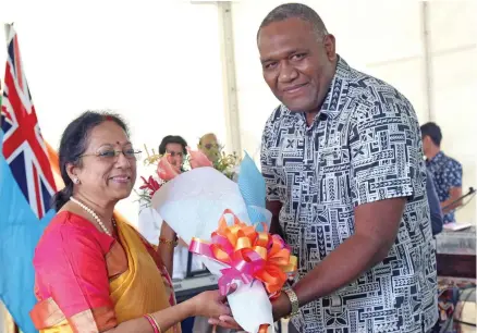  ?? Photo: Kelera Sovasiga ?? Representa­tive from the Office of the Prime Minister, Jone Biaukula receives a bouquet of flowers from the India High Commission­er to Fiji, Padmaja on August 15, 2020.