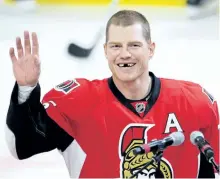  ?? THE CANADIAN PRESS FILES ?? Chris Neil salutes the crowd last December during a ceremony to mark his 1,000th NHL game. Neil announced his retirement on Thursday.