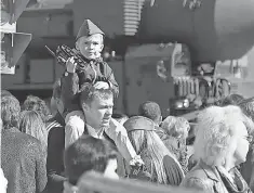  ?? MAXIM SHIPENKOV, EPA ?? People watch as Russian military equipment passes by during a rehearsal for the Victory Day parade in Moscow this May.