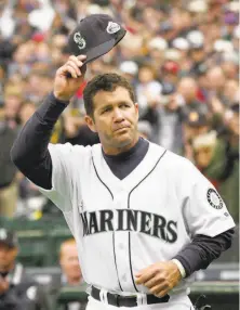  ?? Elaine Thompson / Associated Press 2002 ?? Edgar Martinez, who hit .312 with 309 home runs in 2,055 career games with the Mariners, his only team, is widely credited as revolution­izing the designated hitter position.