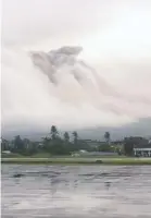  ?? REUTERSPIX ?? Mayon spews ash as it is pictured from Legazpi, Albay yesterday, in this picture obtained from social media.
