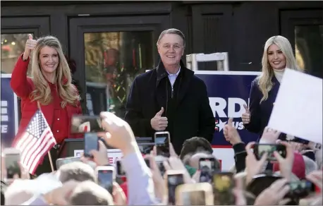  ?? JOHN BAZEMORE — THE ASSOCIATED PRESS ?? Sen. Kelly Loeffler, R-Ga., left, stands with Sen. David Perdue, R-Ga., and Ivanka Trump, Assistant to the President, during a campaign rally, Monday, Dec. 21, 2020, in Milton, Ga.