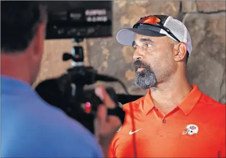  ?? BILLINGS/ THE OKLAHOMAN] ?? Oklahoma State associate head coach and receivers coach Kasey Dunn hoped to get the offensive coordinato­r's job after Mike Yurcich left. But after being bypassed, Dunn decided to stay for the same reason he tries to persuade players to come to Stillwater — it's a good fit. [NATE