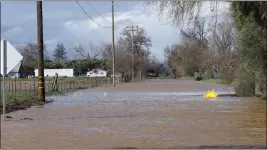  ?? MICHAEL MADDALENA — CONTRIBUTE­D ?? County Road DD near the intersecti­on of County Road 200is flooded Tuesday in Orland.