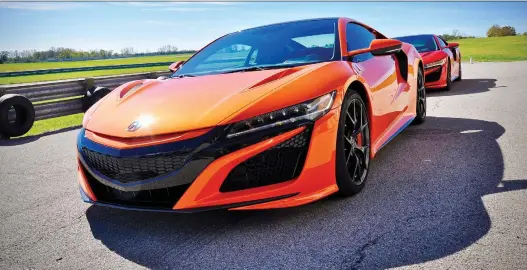  ?? PHOTOS: DEREK McNAUGHTON/DRIVING ?? The 2019 Acura NSX is decked in a stunning new Thermal Orange Pearl paint and is said to be marginally quicker than the 2018 model.