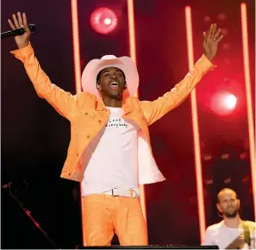  ?? (Jason Kempin/Getty Images/TNS) ?? RAPPER LIL NAS X’ ‘Old Town Road’ has engendered countless debates over what ‘country music’ is.