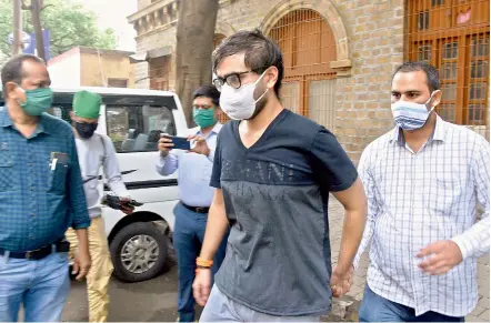  ?? —PTI ?? Alleged drug peddler Suryadeep Mehrotra friend of Showvik Chakrabort­y, accused in connection with Sushant Singh Rajput’s death case, is taken by Narcotics Control Bureau officers for medical examinatio­n at Ballard Estate in Mumbai on Tuesday.