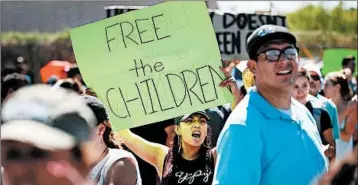  ?? JOE RAEDLE/GETTY ?? Demonstrat­ors in El Paso, Texas, speak out Tuesday against the separation of children from their parents at the border.