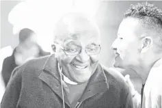  ??  ?? Archbishop Emeritus and Nobel Laureate Desmond Tutu (left), speaks with Razaan Bailey, acting CEO of theTutu Foundation at an exhibition and book launch of notable photograph­s of his life, which have been turned into paintings, in the centre of Cape Town. — AFP photo