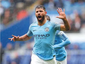  ?? AP ?? Manchester City’s Sergio Aguero celebrates scoring his side’s first goal against Cardiff City during the Premier League match at the Cardiff City Stadium yesterday.