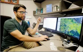  ?? NWA Democrat-Gazette/DAVID GOTTSCHALK ?? Grant Drawve looks over an aggravated assault risk terrain map of the city of Little Rock in his office on the University of Arkansas, Fayettevil­le campus. UA researcher­s, among others, are mapping where terrorist attacks have been planned in the United States.