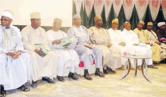  ?? PHOTO ?? Governor Ibrahim Dankwambo of Gombe Sate (fifth left) with chairmen of 12 sector committees inaugurate­d in 2011 to design a blueprint for the state’s developmen­t, at the governor’s score card presentati­on of his administra­tion in Gombe on Saturday. NAN