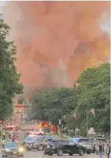  ?? AMBER ARNOLD/WISCONSIN STATE JOURNAL VIA AP ?? The explosion in downtown Sun Prairie, Wisconsin, Tuesday.