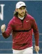  ?? GETTY IMAGES ?? Tommy Fleetwood celebrates a birdie on No. 18 to cap a tournament­best 65.