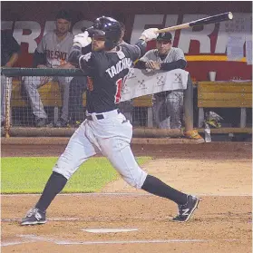  ?? ADOLPHE PIERRE-LOUIS/JOURNAL ?? Isotope Mike Tauchman records a hit against the Fresno Grizzlies on Monday. Albuquerqu­e won 7-1 for its fifth straight victory.