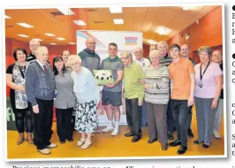  ??  ?? Above, Vikings star Jack Buchanan with Fred, a resident of St Luke’s Care Home in Runcorn, cutting the anniversar­y cake
Left, Jack with Eamon O’Carroll presenting the anniversar­y cake to members of The Chemics Cafe